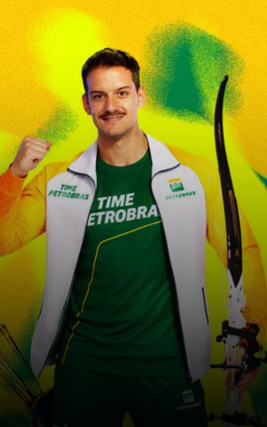A Petrobras Team athlete poses with a bow and arrows, wearing a green and white sports uniform, in reference to archery.