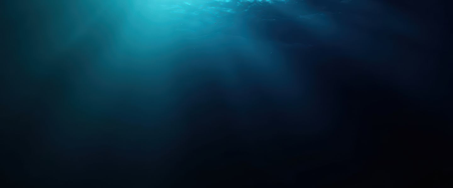 Sunlight rays penetrating dark underwater environment.