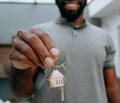 Man holding key to alienated property.