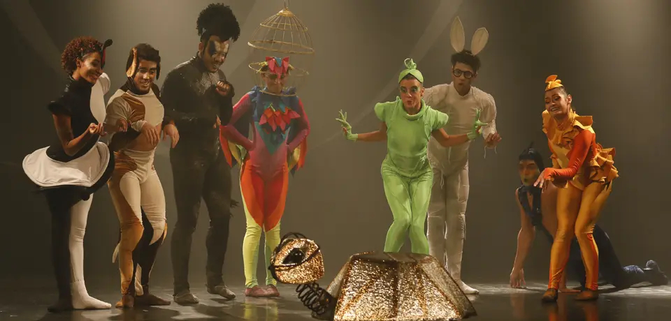 Actors dressed as animals on a stage.
