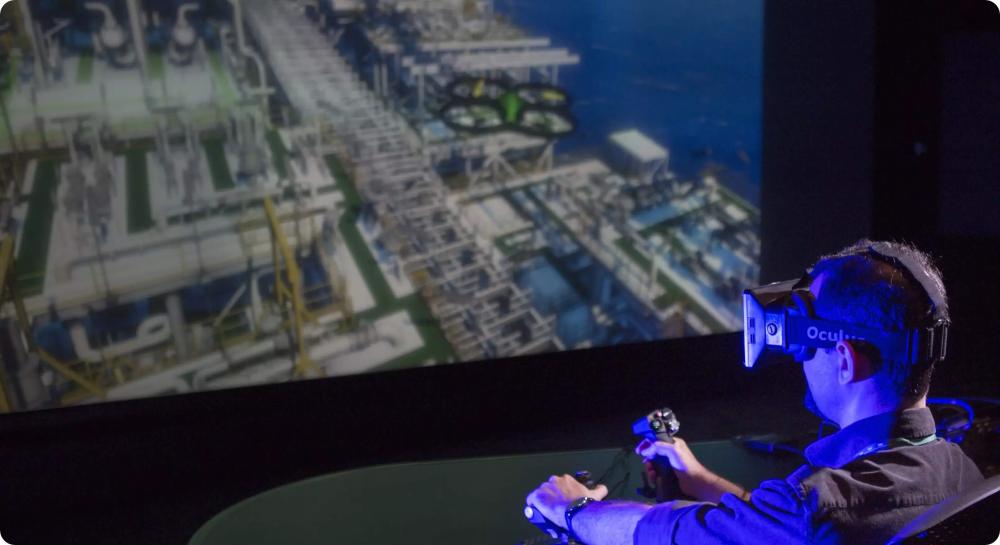 Person using virtual reality glasses to visit a refinery