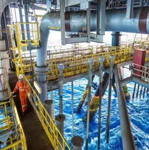 Daytime photograph of the interior of a Petrobras operation in the ocean.