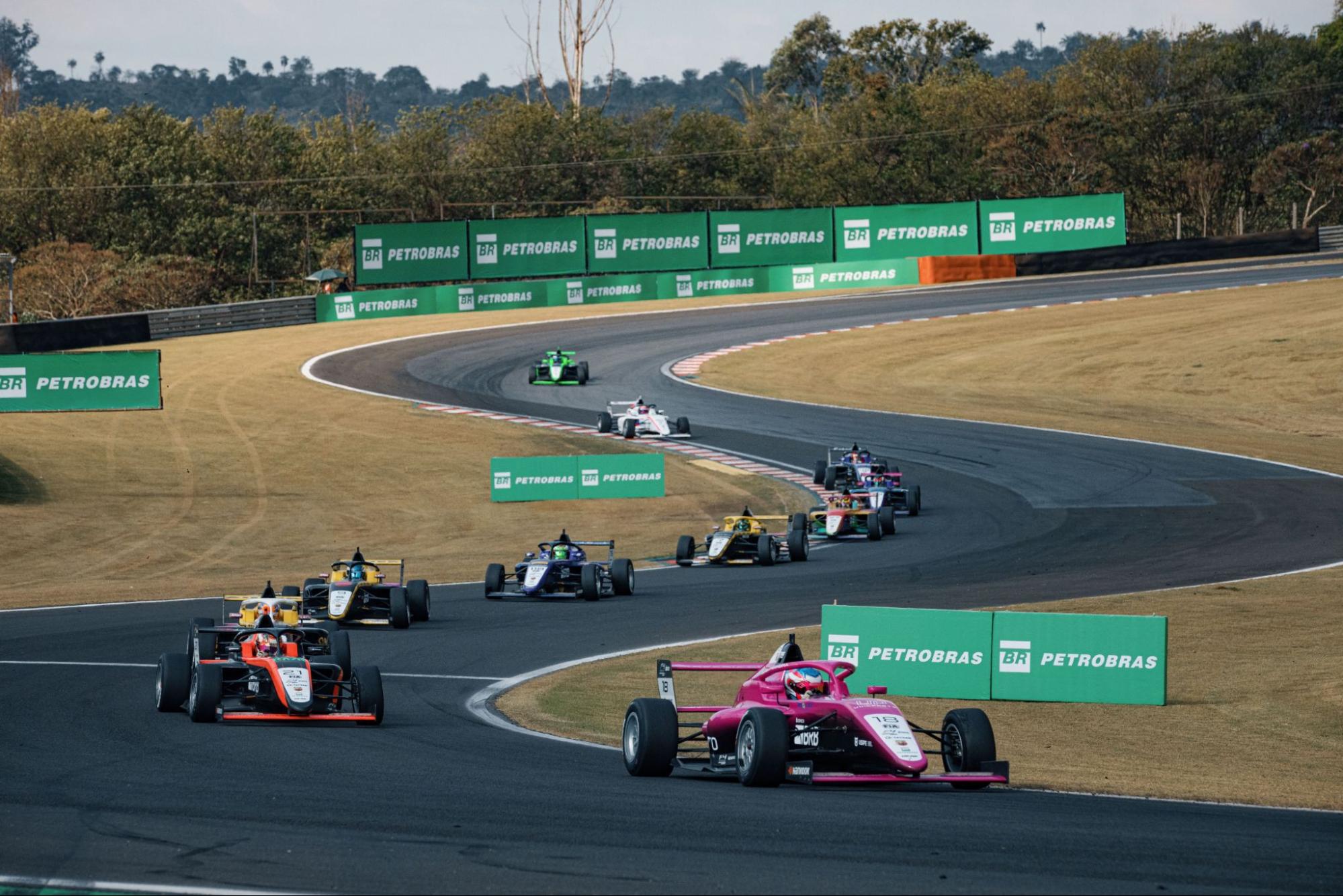 Formula 4 cars lined up on one of the 8 circuits with Petrobras sponsorship signs.