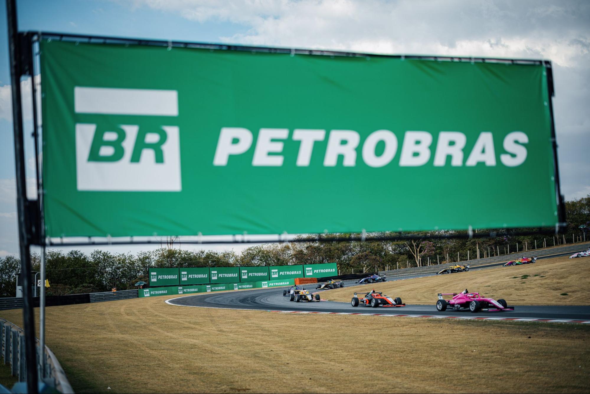 Petrobras sponsorship sign in the foreground over F4 cars.