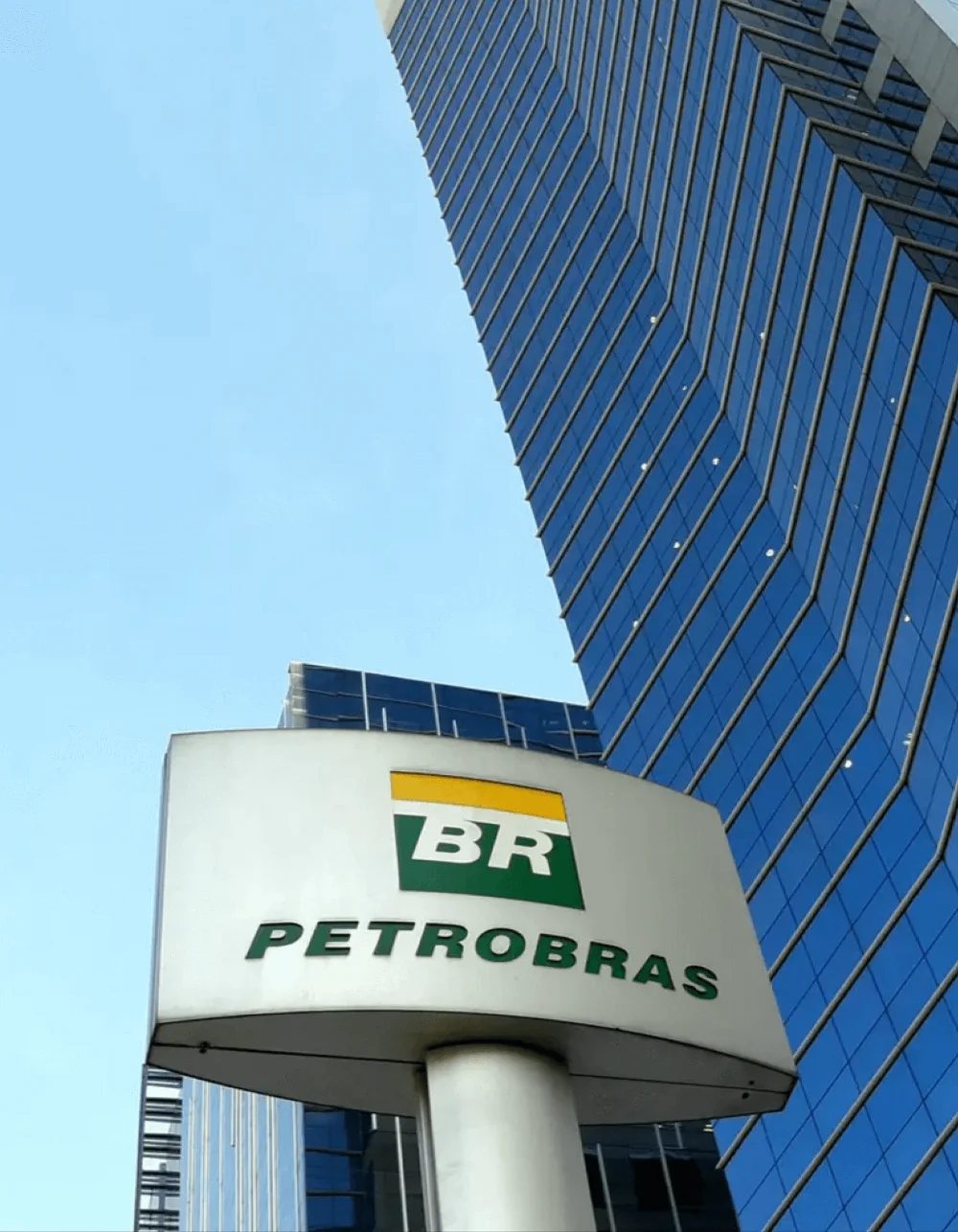 Petrobras brand on a metallic plate, in front of a company office.