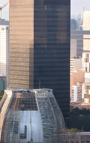 Petrobras headquarters building in downtown Rio de Janeiro, surrounded by other city skyscrapers.