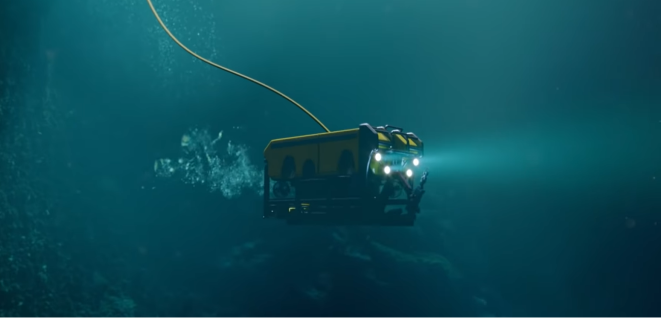 Underwater robot with frontal lights on.
